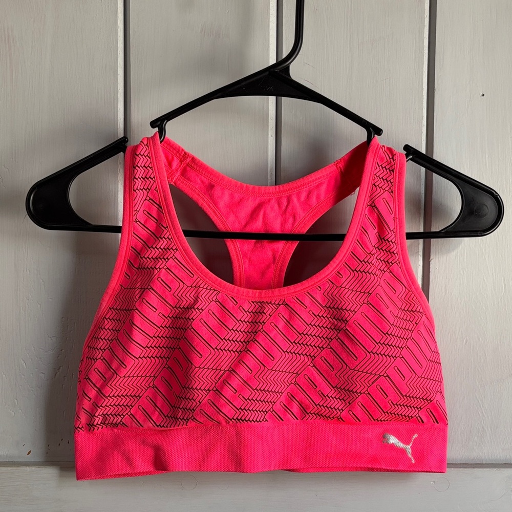 TWO PUMA SPORTS BRAS- A Vibrant Pink Sports Bra AND a Black Sports Bra.